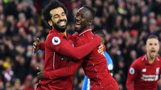 LIVERPOOL, ENGLAND - APRIL 26: Naby Keita of Liverpool (8) celebrates after scoring his team's first goal with Mohamed Salah during the Premier League match between Liverpool FC and Huddersfield Town at Anfield on April 26, 2019 in Liverpool, United Kingdom. (Photo by Michael Regan/Getty Images)