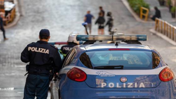 Rome, Italy - October 9, 2020: policeman on patrol with Italian police car, in checkpoint in the city.